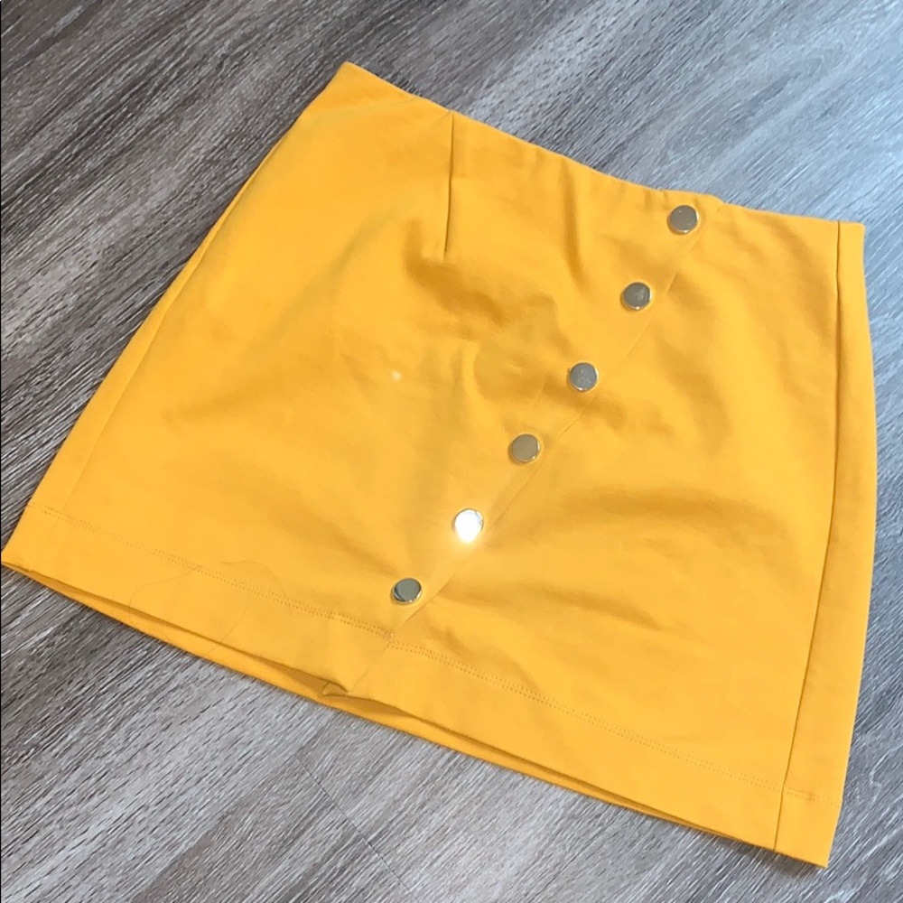 Mustard yellow snap front mini skirt